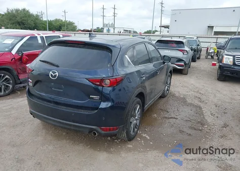 2021 Mazda Cx-5 Signature z USA, uszkodzony, nr VIN JM3KFBEY1M0343561